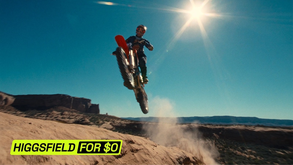 A motocross rider jumping over a desert ridge with a "HIGGSFIELD FOR $0" badge in the lower left, the hero image of the post announcing the one-day $0 unlimited trial on July 22, 2026. The promotion ended on July 23, 2026 and is not available now. Source: Higgsfield official blog (July 2026)